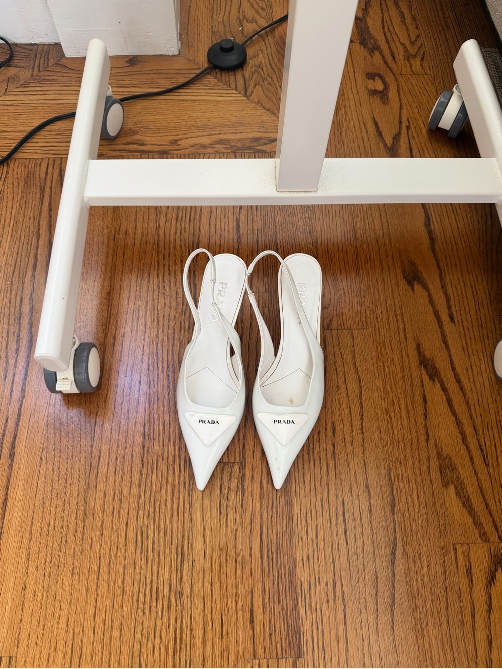 Prada White Pointed Slingback Pumps with Logo Plaque